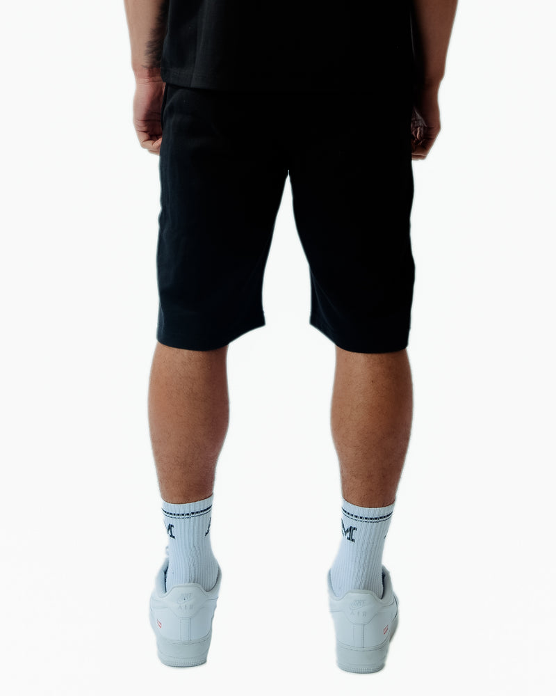 Short negro gráfico Angeli